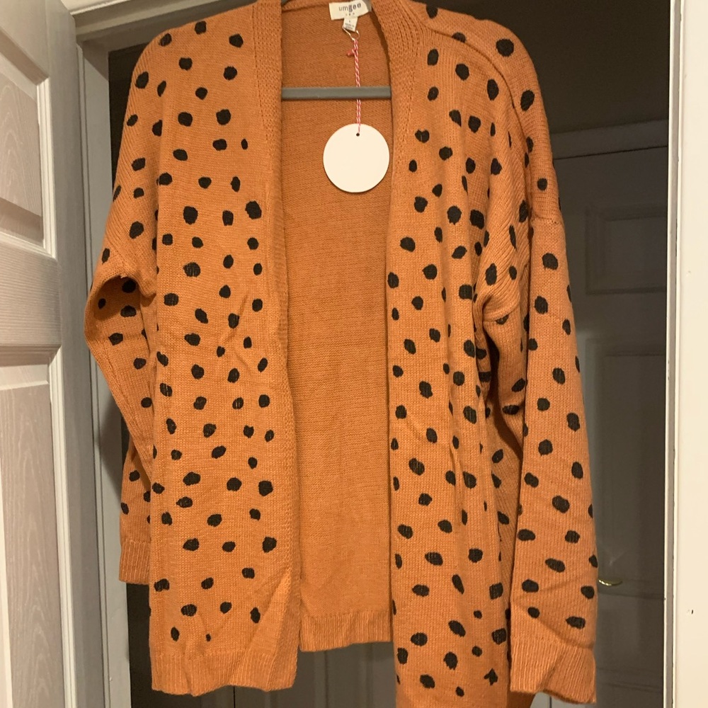 Orange with black spots. Super cute fall cardigan! Size Large. Never worn!